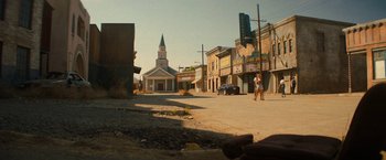 Movie still from “Texas Chainsaw Massacre” (2022), directed by David Blue Garcia – Two people standing on the side of the street; Extreme Wide shot, Low angle