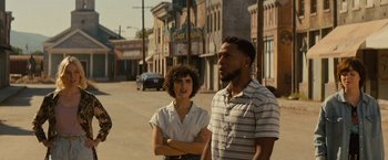 Movie still from “Texas Chainsaw Massacre” (2022), directed by David Blue Garcia – A man and a woman standing on the side of the street; Medium shot, Over the shoulder angle