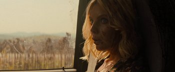 Movie still from “Texas Chainsaw Massacre” (2022), directed by David Blue Garcia – A blonde woman with blood all over her face looking out a window; Close Up shot, Over the shoulder angle