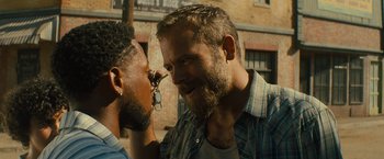 Movie still from “Texas Chainsaw Massacre” (2022), directed by David Blue Garcia – A man with a beard is talking to another man with a beard; Close Up shot, Over the shoulder angle