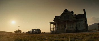 Movie still from “Texas Chainsaw Massacre” (2022), directed by David Blue Garcia – A van is parked in front of a house; Extreme Wide shot, Low angle