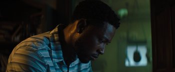 Movie still from “Texas Chainsaw Massacre” (2022), directed by David Blue Garcia – A person looking down at his face; Close Up shot, Low angle