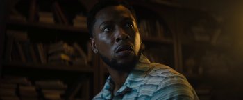 Movie still from “Texas Chainsaw Massacre” (2022), directed by David Blue Garcia – A person wearing a striped shirt; Close Up shot, Low angle