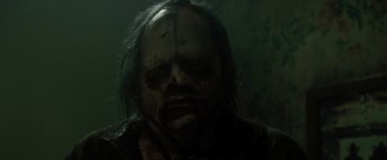 Movie still from “Texas Chainsaw Massacre” (2022), directed by David Blue Garcia – A person with blood on their face; Close Up shot, Low angle
