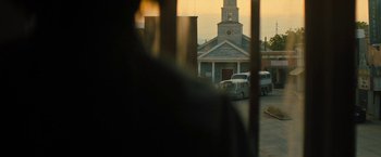 Movie still from “Texas Chainsaw Massacre” (2022), directed by David Blue Garcia – A view of a church from a car window; Extreme Wide shot, Low angle