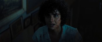 Movie still from “Texas Chainsaw Massacre” (2022), directed by David Blue Garcia – A woman with blood all over her face; Close Up shot, Over the shoulder angle