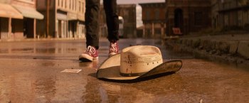 Movie still from “Texas Chainsaw Massacre” (2022), directed by David Blue Garcia – A cowboy hat laying in the middle of the street; Close Up shot, Low angle
