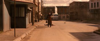 Movie still from “Texas Chainsaw Massacre” (2022), directed by David Blue Garcia – A man standing on the side of the street; Extreme Wide shot, Low angle