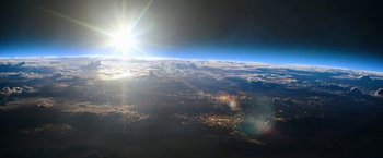 Movie still from “The Adam Project” (2022), directed by Shawn Levy – A view of a city from a plane window at night; Extreme Wide shot, High angle