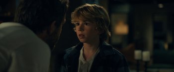 Movie still from “The Adam Project” (2022), directed by Shawn Levy – A young boy is looking at a man; Close Up shot, Over the shoulder angle