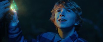 Movie still from “The Adam Project” (2022), directed by Shawn Levy – A young man looking up into the air; Close Up shot, Low angle