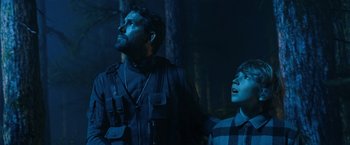 Movie still from “The Adam Project” (2022), directed by Shawn Levy – A man and a boy are standing in the woods; Medium shot, Over the shoulder angle