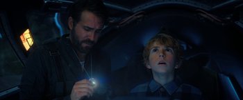 Movie still from “The Adam Project” (2022), directed by Shawn Levy – A man and a boy in a car looking at each other; Close Up shot, Over the shoulder angle