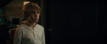 Movie still from “The Adam Project” (2022), directed by Shawn Levy – A young boy standing in front of a mirror; Close Up shot, Over the shoulder angle