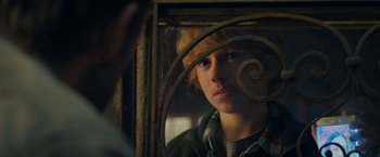 Movie still from “The Adam Project” (2022), directed by Shawn Levy – A young boy is looking into a mirror; Close Up shot, Over the shoulder angle
