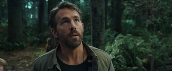 Movie still from “The Adam Project” (2022), directed by Shawn Levy – A person looking up at the sky; Close Up shot, Over the shoulder angle