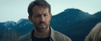 Movie still from “The Adam Project” (2022), directed by Shawn Levy – A person wearing a jacket; Close Up shot, Over the shoulder angle