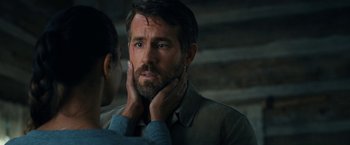 Movie still from “The Adam Project” (2022), directed by Shawn Levy – A man and a woman looking at one another; Close Up shot, Over the shoulder angle