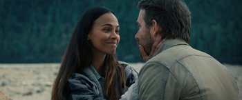 Movie still from “The Adam Project” (2022), directed by Shawn Levy – A man and a woman smiling at each other; Close Up shot, Over the shoulder angle