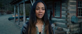 Movie still from “The Adam Project” (2022), directed by Shawn Levy – A person with long black hair; Close Up shot, Over the shoulder angle