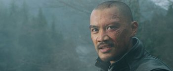 Movie still from “The Adam Project” (2022), directed by Shawn Levy – A person wearing a jacket with blood all over his face; Close Up shot, Low angle