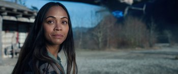 Movie still from “The Adam Project” (2022), directed by Shawn Levy – A person with long black hair; Close Up shot, Over the shoulder angle