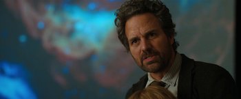 Movie still from “The Adam Project” (2022), directed by Shawn Levy – A person wearing a suit and tie; Close Up shot, Over the shoulder angle