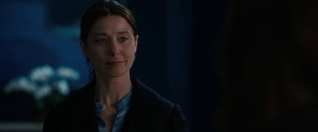 Movie still from “The Adam Project” (2022), directed by Shawn Levy – A person wearing a suit; Close Up shot, Over the shoulder angle