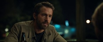 Movie still from “The Adam Project” (2022), directed by Shawn Levy – A person wearing a jacket; Close Up shot, Over the shoulder angle