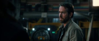 Movie still from “The Adam Project” (2022), directed by Shawn Levy – A person wearing a shirt; Close Up shot, Over the shoulder angle