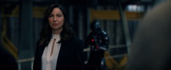 Movie still from “The Adam Project” (2022), directed by Shawn Levy – A woman standing in front of a man in a black suit; Close Up shot, Over the shoulder angle