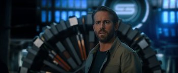 Movie still from “The Adam Project” (2022), directed by Shawn Levy – A person with a beard; Close Up shot, Over the shoulder angle