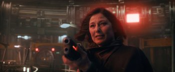 Movie still from “The Adam Project” (2022), directed by Shawn Levy – A woman is holding a gun in her hand; Close Up shot, Low angle