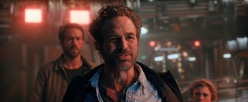 Movie still from “The Adam Project” (2022), directed by Shawn Levy – A person with a beard; Close Up shot, Over the shoulder angle