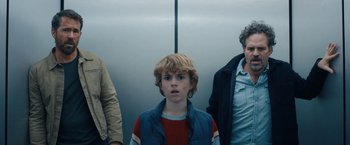 Movie still from “The Adam Project” (2022), directed by Shawn Levy – A group of people standing next to each other; Medium shot, Low angle