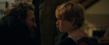 Movie still from “The Adam Project” (2022), directed by Shawn Levy – A man and a boy looking at one another; Close Up shot, Over the shoulder angle