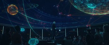 Movie still from “The Adam Project” (2022), directed by Shawn Levy – A man standing on a stage in front of an audience; Extreme Wide shot, Low angle