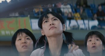 Movie still from “Babel” (2006), directed by Alejandro G. Iñárritu – A woman looking up while standing next to another woman; Close Up shot, Low angle