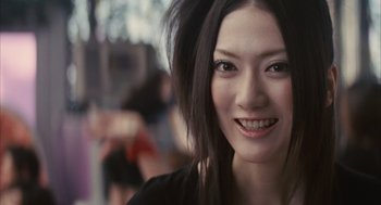 Movie still from “Babel” (2006), directed by Alejandro G. Iñárritu – A person with long black hair; Close Up shot, Low angle