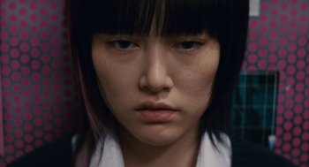 Movie still from “Babel” (2006), directed by Alejandro G. Iñárritu – A person with short black hair; Close Up shot, Low angle