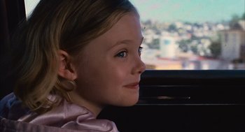 Movie still from “Babel” (2006), directed by Alejandro G. Iñárritu – A little girl sitting in a car looking out the window; Close Up shot, Over the shoulder angle