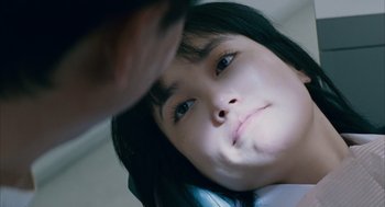 Movie still from “Babel” (2006), directed by Alejandro G. Iñárritu – A young girl is sitting on a phone; Close Up shot, Overhead angle