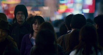 Movie still from “Babel” (2006), directed by Alejandro G. Iñárritu – A group of people that are standing in the street; Close Up shot, Over the shoulder angle