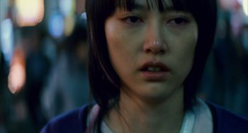 Movie still from “Babel” (2006), directed by Alejandro G. Iñárritu – A woman's face in the dark; Close Up shot, Low angle