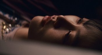 Movie still from “Babel” (2006), directed by Alejandro G. Iñárritu – A woman's face as she lays down; Extreme Close Up shot, High angle