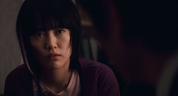 Movie still from “Babel” (2006), directed by Alejandro G. Iñárritu – A young asian woman sitting in front of a window; Close Up shot, Over the shoulder angle