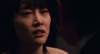 Movie still from “Babel” (2006), directed by Alejandro G. Iñárritu – A person looking at the camera; Close Up shot, Over the shoulder angle