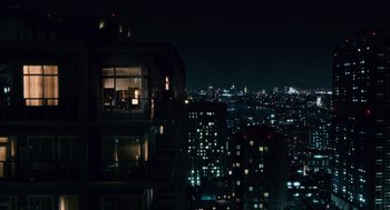 Movie still from “Babel” (2006), directed by Alejandro G. Iñárritu – A view of a city at night from a building; Extreme Wide shot, High angle