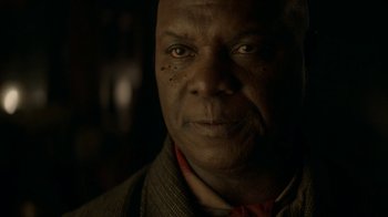 Movie still from “The Alienist” (2018), created by Cary Joji Fukunaga – An older man is looking into the camera; Close Up shot, Low angle