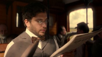 Movie still from “The Alienist” (2018), created by Cary Joji Fukunaga – Close Up shot, Over the shoulder angle